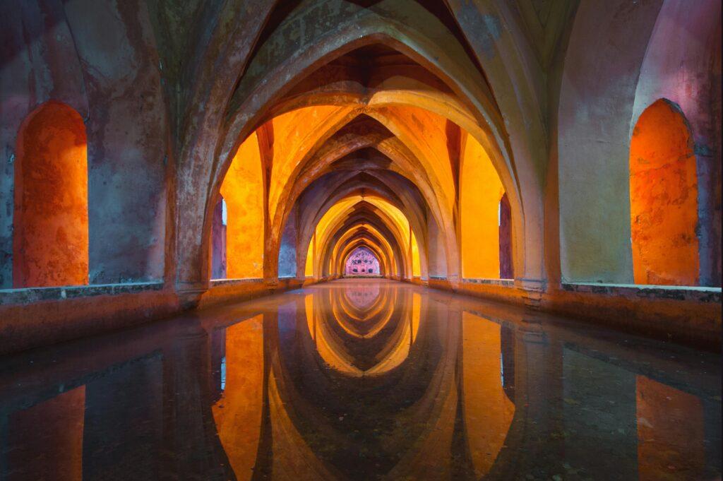 Beautiful Gothic arches reflecting in water, vibrant colors create a mesmerizing effect.